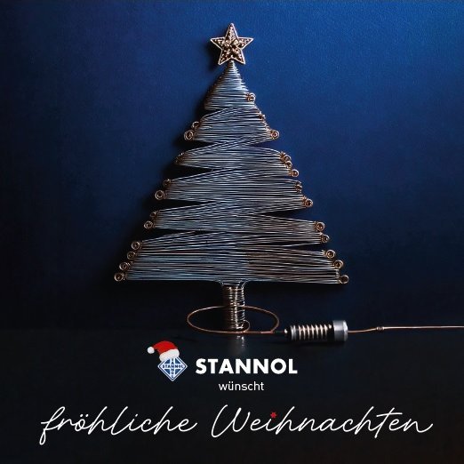 The picture shows a Christmas card with a wire Christmas tree. Underneath it says: Stannol wishes you a Merry Christmas.